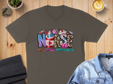 Load image into Gallery viewer, Nurse graphic with coffee, scrubs, and rubber gloves on a t-shirt.
