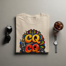 Load image into Gallery viewer, T-shirt with "CQ CQ" graphic featuring microphone, radio tower, and meter.
