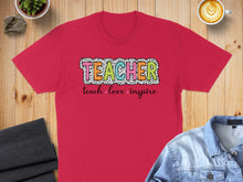Load image into Gallery viewer, Red t-shirt with "TEACHER" in colorful polka dot letters and "teach love inspire" below.
