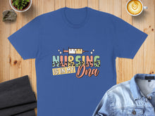 Load image into Gallery viewer, Blue t-shirt with "Nursing is in my DNA" text and syringe graphic.
