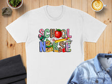 Load image into Gallery viewer, White t-shirt with "School Nurse" text design featuring school supplies.
