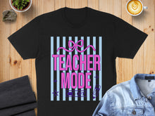 Load image into Gallery viewer, Black t-shirt with "TEACHER MODE" text in pink and purple stripes.
