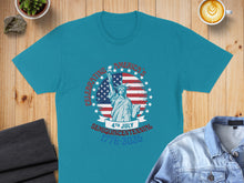 Load image into Gallery viewer, Teal t-shirt with Statue of Liberty and American flag graphic reading "Celebrating America's Semiquincentennial 1776-2026".
