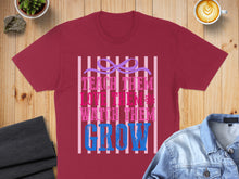 Load image into Gallery viewer, Maroon t-shirt with "Teach Them Love Them Watch Them Grow" text and bow graphic.
