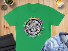 Load image into Gallery viewer, Green t-shirt with "It's a beautiful day to save lives" and a leopard print smiley face.
