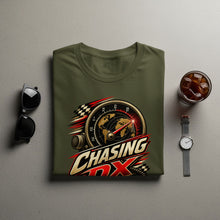 Load image into Gallery viewer, Green t-shirt with "Chasing DX" logo featuring a globe and radio dial.
