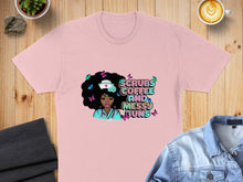Load image into Gallery viewer, Pink t-shirt with "Scrubs Coffee and Messy Buns" graphic featuring a nurse.
