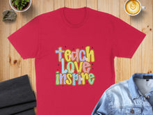 Load image into Gallery viewer, Red t-shirt with "Teach Love Inspire" text in colorful, playful lettering.
