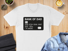 Load image into Gallery viewer, T-shirt with "BANK OF DAD" credit card design, listing "I. M. BROKE".
