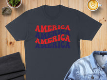 Load image into Gallery viewer, Dark blue t-shirt with "AMERICA" repeated three times in red and blue wavy text.

