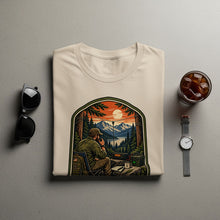 Load image into Gallery viewer, Graphic tee with vintage outdoor scene of man using radio with mountains and lake.

