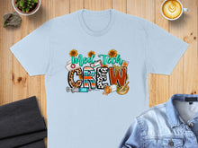 Load image into Gallery viewer, "Med Tech Crew" text with medical and sunflower graphic elements on a light blue t-shirt.
