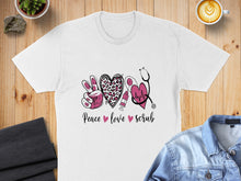 Load image into Gallery viewer, White t-shirt with "Peace Love Scrub" text and medical symbols.
