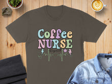 Load image into Gallery viewer, Brown t-shirt with colorful "Coffee Nurse Repeat" text and heart monitor design.
