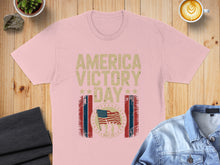 Load image into Gallery viewer, Pink t-shirt with "America Victory Day May 08" text and American flag graphic.
