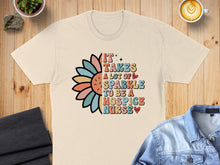 Load image into Gallery viewer, T-shirt with "It takes a lot of sparkle to be a hospice nurse" and daisy.
