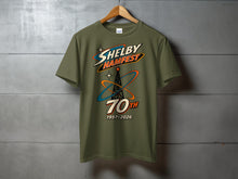 Load image into Gallery viewer, Olive t-shirt with Shelby Hamfest 70th 1957-2026 graphic.
