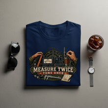 Load image into Gallery viewer, Navy blue t-shirt with a graphic of amateur radio equipment and "Measure Twice Tune Once" text.
