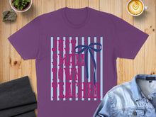Load image into Gallery viewer, Purple t-shirt with "Just a small town teacher" text and blue bow.
