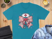 Load image into Gallery viewer, Teal t-shirt featuring a pink bow with a stethoscope, nurse's cap, and XOXO hearts.
