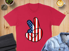 Load image into Gallery viewer, Red t-shirt with American flag peace sign graphic.
