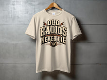 Load image into Gallery viewer, Cream t-shirt with "OLD RADIOS NEVER DIE" graphic and vintage radio knob detail.
