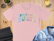 Load image into Gallery viewer, Pink t-shirt with "NURSE" spelled in colorful, patterned patchwork letters.
