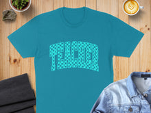 Load image into Gallery viewer, Teal t-shirt with "TEACHER" in a checkerboard pattern, flat lay.
