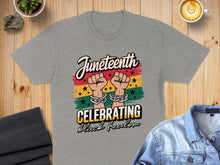 Load image into Gallery viewer, Juneteenth celebrating black freedom t-shirt with chained fists.
