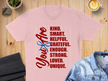 Load image into Gallery viewer, Pink t-shirt with "You Are KIND. SMART. HELPFUL. GRATEFUL. ENOUGH. STRONG. LOVED. UNIQUE." text.
