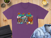 Load image into Gallery viewer, Purple t-shirt with "MED TECH CREW" in colorful letters and medical graphics.
