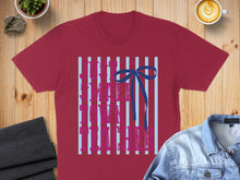 Load image into Gallery viewer, Maroon t-shirt with "Just a teacher" text and a blue bow.

