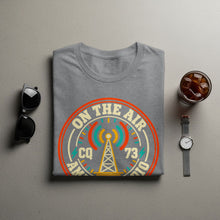 Load image into Gallery viewer, Grey t-shirt with "ON THE AIR CQ 73 AMERICAN 10" text and radio tower graphic.

