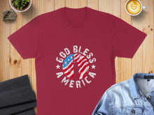 Load image into Gallery viewer, Maroon t-shirt with "God Bless America" text and American flag graphic.
