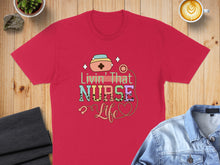 Load image into Gallery viewer, Red t-shirt with colorful "Livin' That Nurse Life" graphic.
