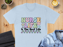 Load image into Gallery viewer, Light blue t-shirt with "Nurse Life Is The Best Life" text design.
