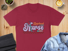 Load image into Gallery viewer, Maroon t-shirt with "Registered Nurse" text and stethoscope graphic.
