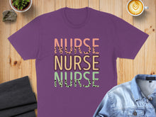 Load image into Gallery viewer, Purple t-shirt with "NURSE NURSE NURSE" in colorful, patterned text.
