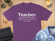 Load image into Gallery viewer, Purple t-shirt with white text "Teacher. Because multitasking ninja is not an official job title."
