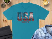 Load image into Gallery viewer, Teal t-shirt with "USA" graphic in American flag pattern, "Since 1776".
