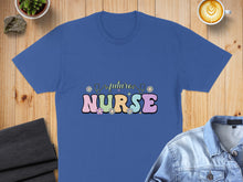Load image into Gallery viewer, "Future Nurse" text with colorful flowers and stars on a royal blue t-shirt.
