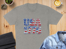 Load image into Gallery viewer, Grey t-shirt with "USA 1776" in a patriotic star and stripe pattern.
