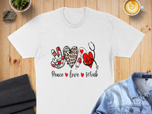 Load image into Gallery viewer, White t-shirt with "Peace love scrub" text and medical icons.
