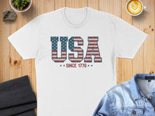 Load image into Gallery viewer, White t-shirt with "USA SINCE 1776" text in distressed American flag print.
