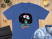Load image into Gallery viewer, Blue t-shirt with graphic of a nurse with afro, mask, and "Trauma Queen" text.
