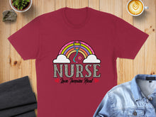Load image into Gallery viewer, Burgundy t-shirt with "Nurse Love Inspire Heal" text and rainbow stethoscope design.
