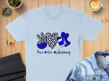 Load image into Gallery viewer, Blue t-shirt with leopard print peace sign, heart, and medicine bottle.
