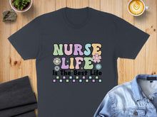 Load image into Gallery viewer, Dark t-shirt with colorful "Nurse Life Is The Best Life" text and flowers.
