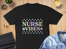 Load image into Gallery viewer, Black t-shirt with "Nurse Vibes" text in pastel checkered pattern and floral accents.

