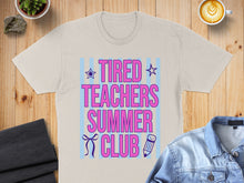 Load image into Gallery viewer, Light beige t-shirt with "TIRED TEACHERS SUMMER CLUB" text in pink and blue.
